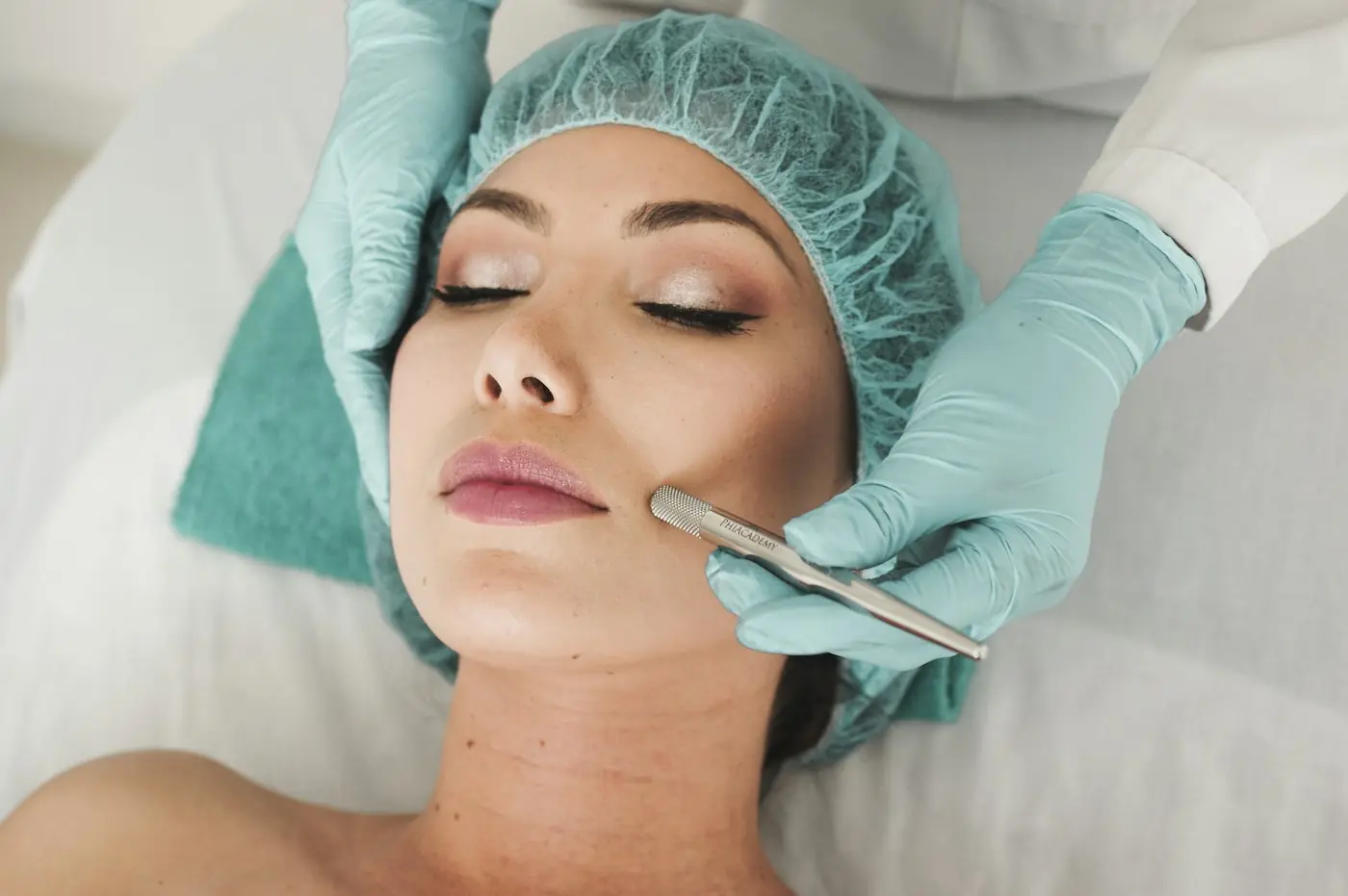 A nurse injector preparing a client for treatment in a bright clinic room