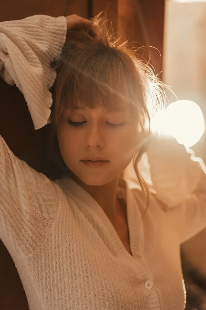 A woman in warm evening light, relaxed and glowing